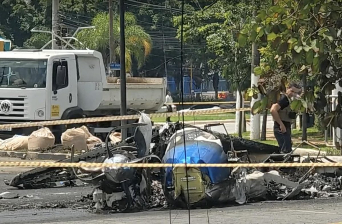 Two dead in fiery crash as small plane hits bus on major avenue in Sao Paulo