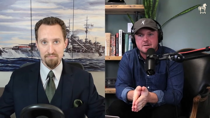 E.J. Antoni seems to have no issue sitting in front of the Nazi warship while being interviewed.