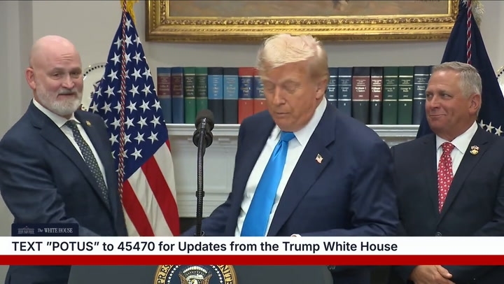 Standing just behind the president, MAGA Rep. Derrick Van Orden appeared to awkwardly mouth, 'I'm here.'