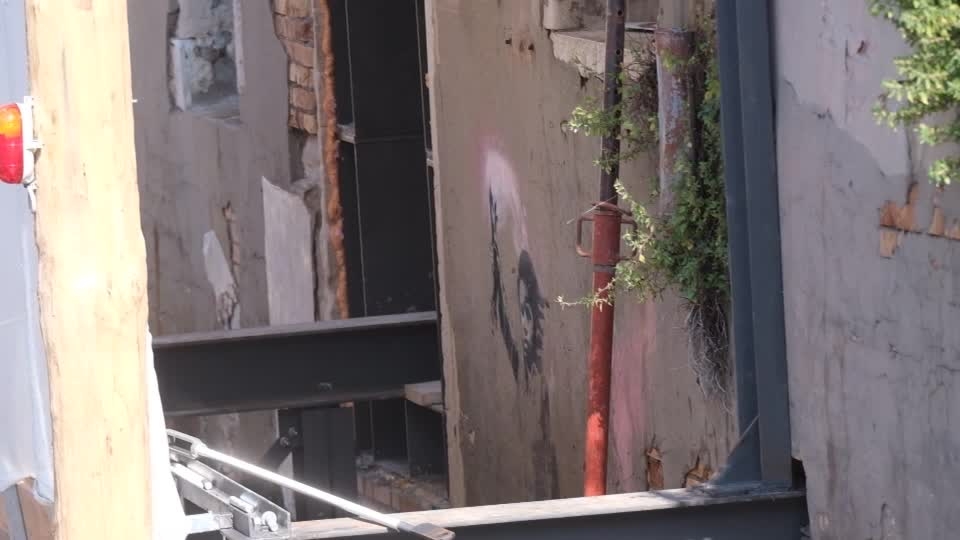 Scaffolding goes up in Venice to save Banksy's migrant mural