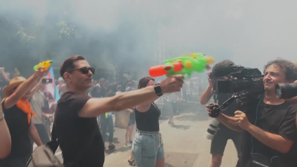 Barcelona residents protest tourism with water pistols and smoke bombs