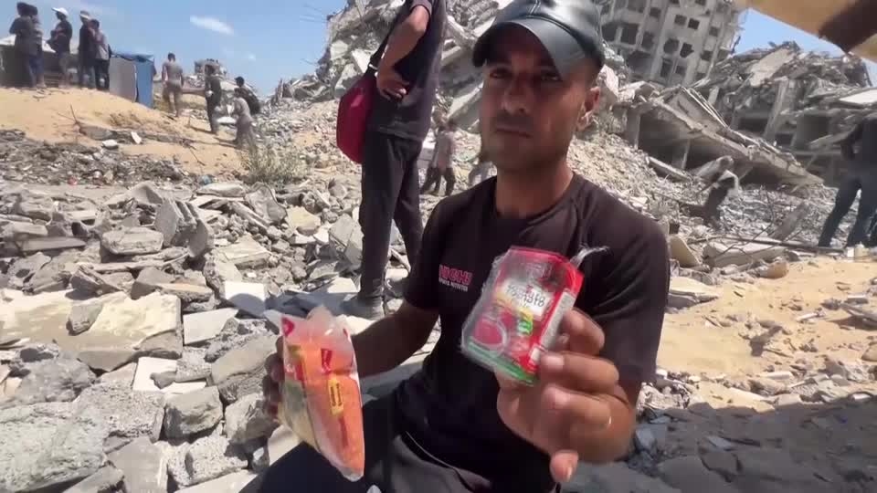 Palestinians scramble for aid, as it is airdropped over north Gaza