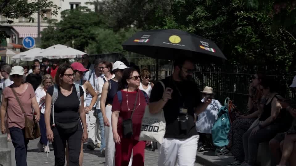 Tourists cool off by Paris fountains in France's heatwave