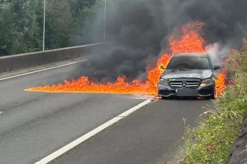 Pictures show scale of fierce car fire which shut major road