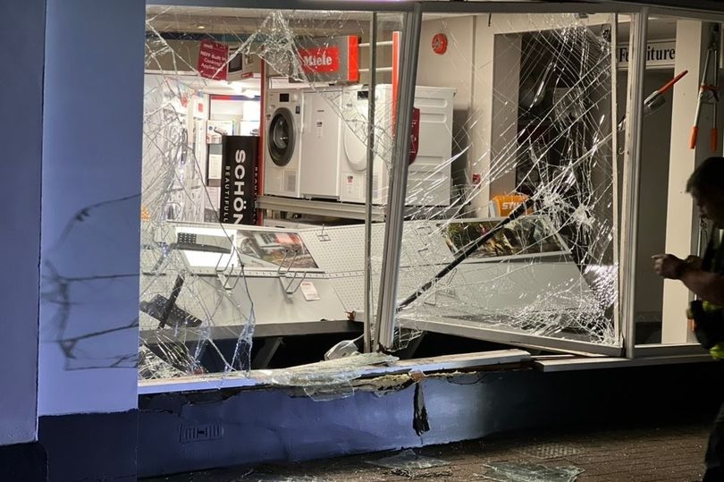 A Jaguar F-Pace was driven into this shop and £6,000 of goods were stolen