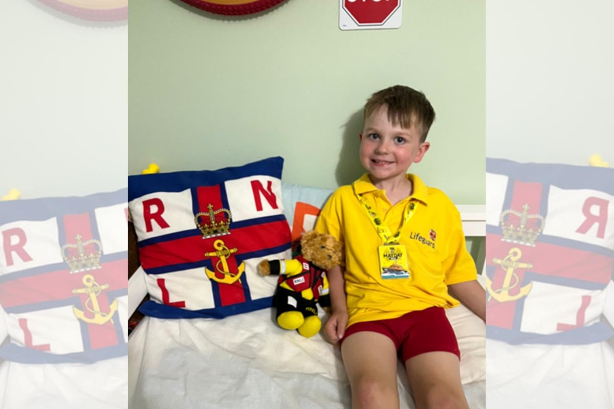 Warrington youngster visited in school by his heroes after raising £1,000