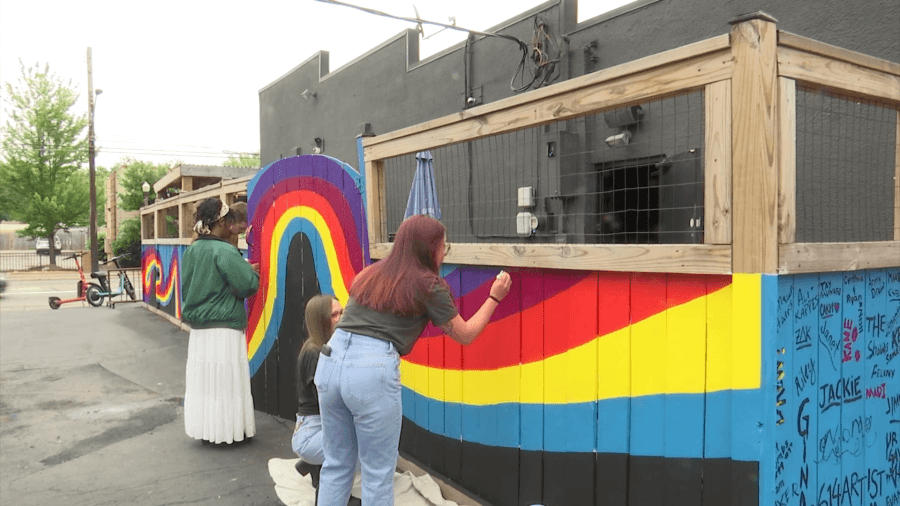 Locals paint rainbow fence at German Village bar that had Pride flags stolen