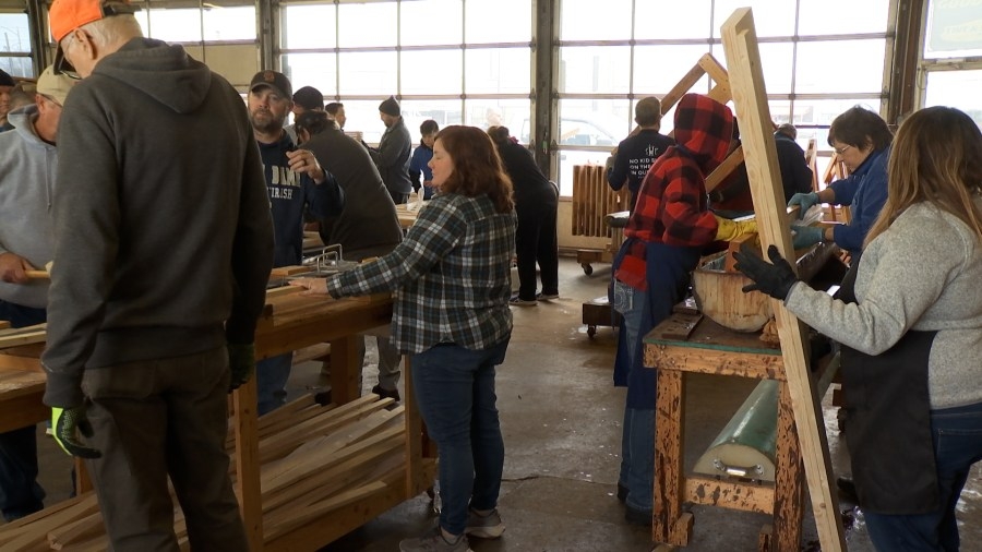 Volunteers build dozens of beds for Evansville children