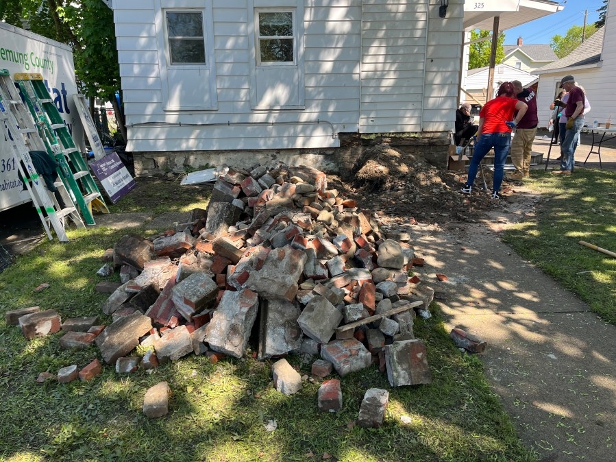 Volunteers refurbish Elmira homes for Habitat for Humanity