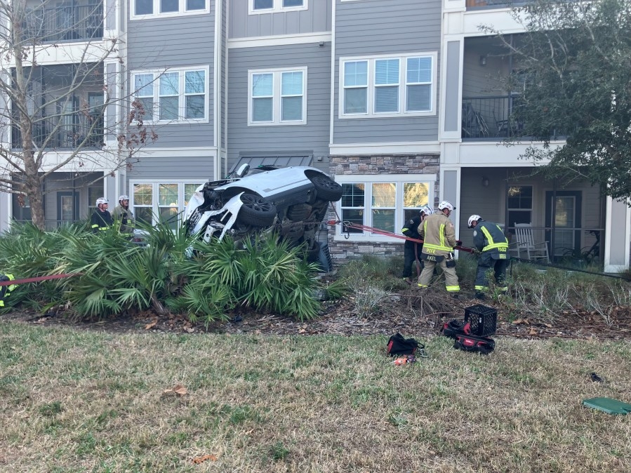 Range Rover flips into Pasco apartment AC units: FHP