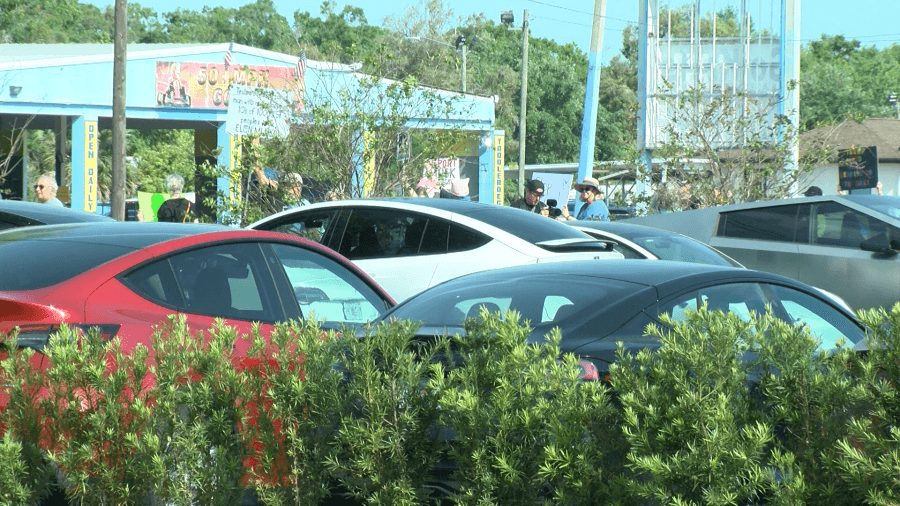 Dozens gather at Tesla dealerships, to both protest and support