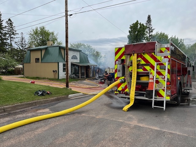 Flames from fire pit spread to nearby building in Wisconsin, damage limited