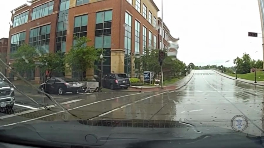 Police in Wisconsin urge attentiveness after camera footage shows pedestrian hit by car, traffic light