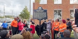 A historical marker is unveiled to commemorate the site of the original Jones High School
