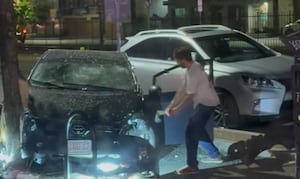 ‘He kept swinging!': New surveillance shows road rage victim running from hatchet wielding suspect