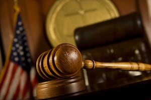 Two Dorchester men indicted on counts of unlawful possession of firearms