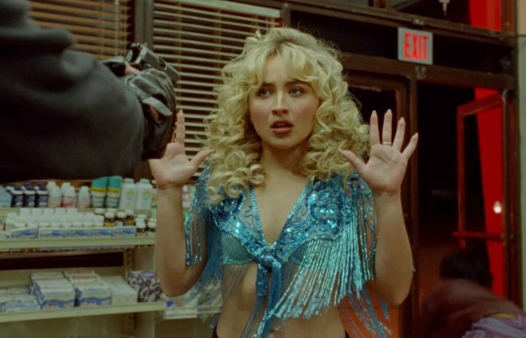 Sabrina Carpenter Hitchhikes Through Hell in Her 'Manchild' Music Video and Somehow Looks Flawless Doing It