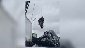 Driver rescued from semi-truck hanging off major interstate in Kentucky
