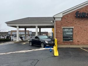 Car crashes into machine, barrier in bank drive-thru