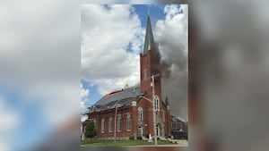 Smoke, flames pour from large fire at local Catholic church