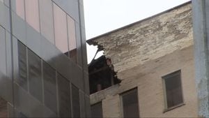 Part of busy road remains closed days after strong winds cause partial collapse of Dayton building