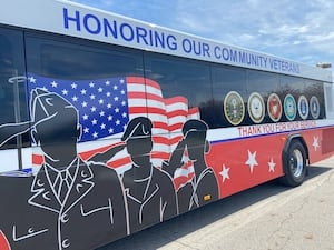 Swapping green for something more patriotic; RTA bus gets a new look to celebrate veterans