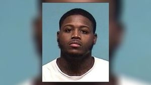 Handcuffed man remains on the loose after escaping police custody Monday