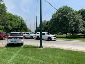 Officer shoots armed man after he runs from them; Police to provide update