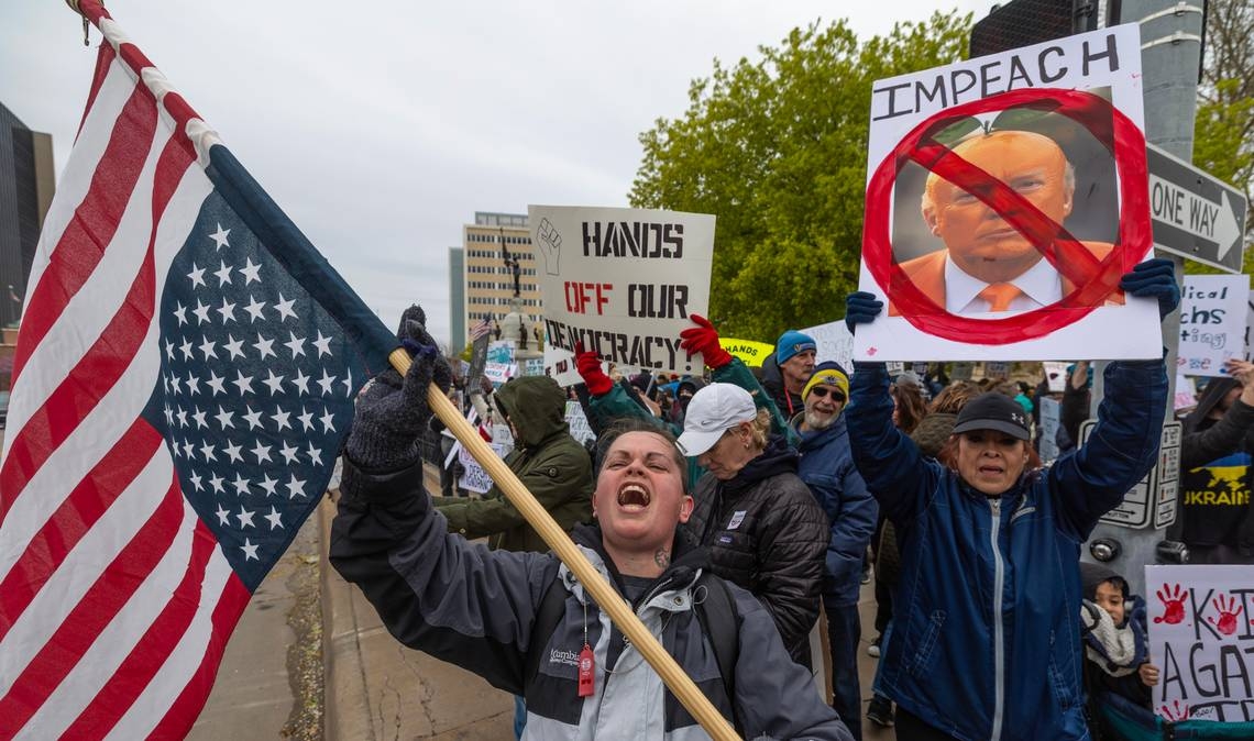 Hundreds protest Trump and Musk in downtown Wichita