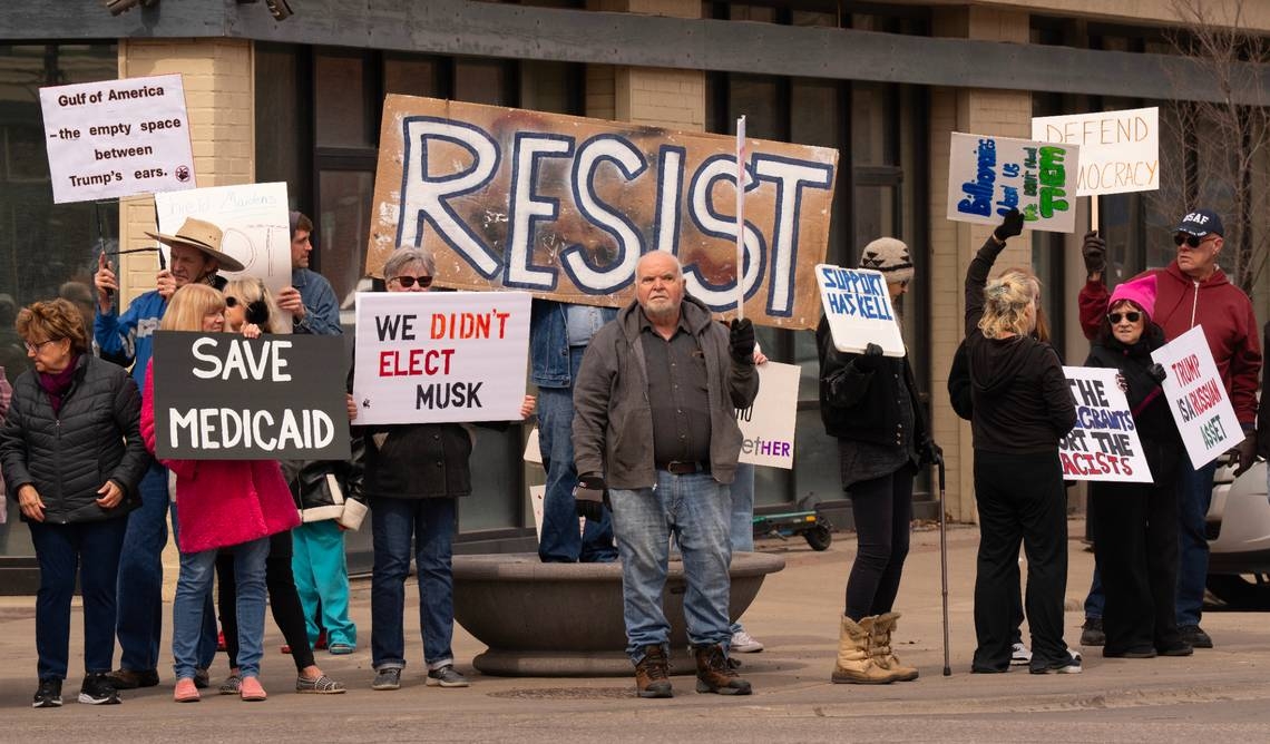 Rep. Ron Estes talks taxes with Americans For Prosperity while crowd protests outside