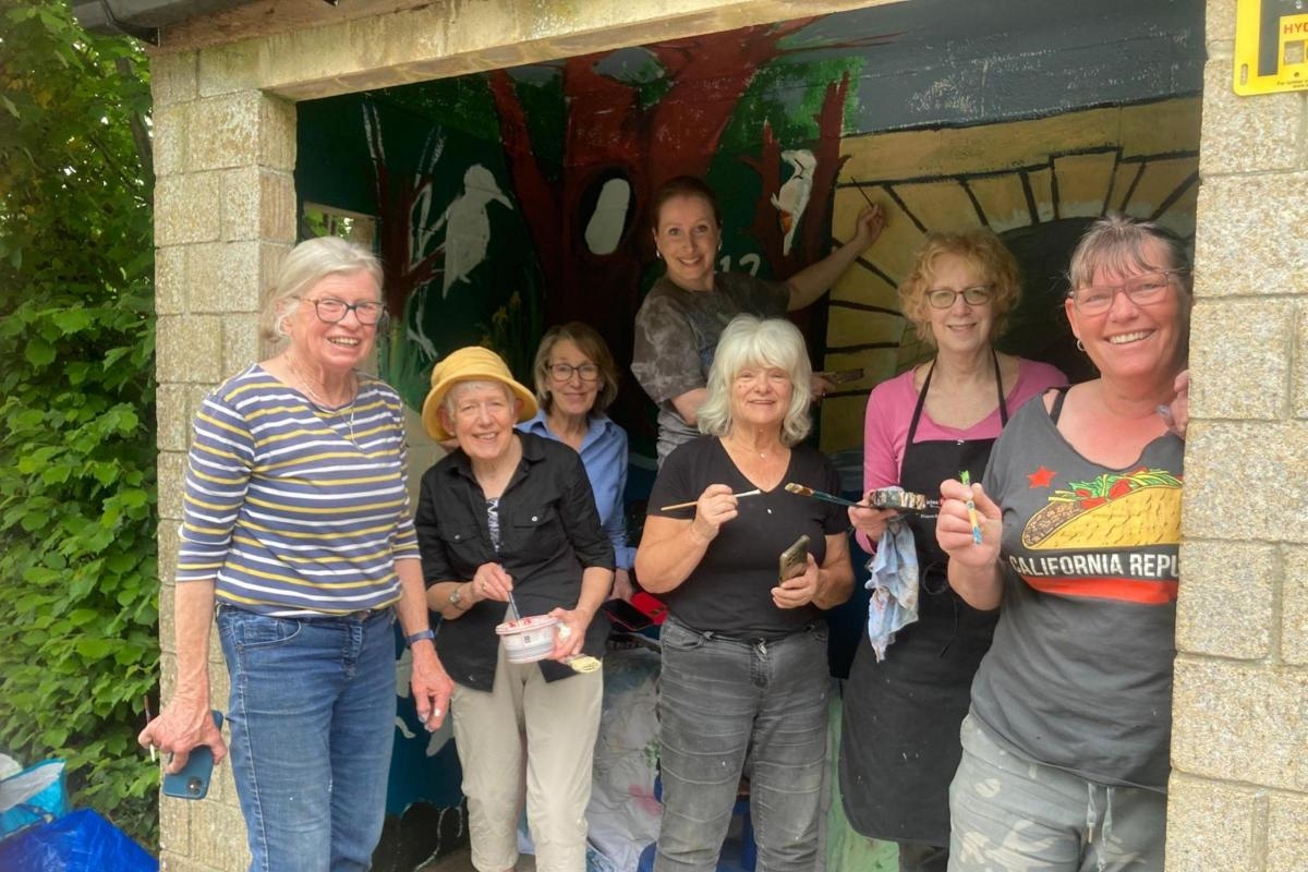 Bus shelter murals appear in town ahead of festival