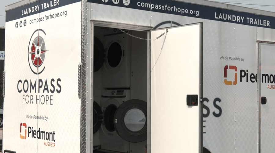 Piedmont Health presenting new laundry trailer to Compass For Hope