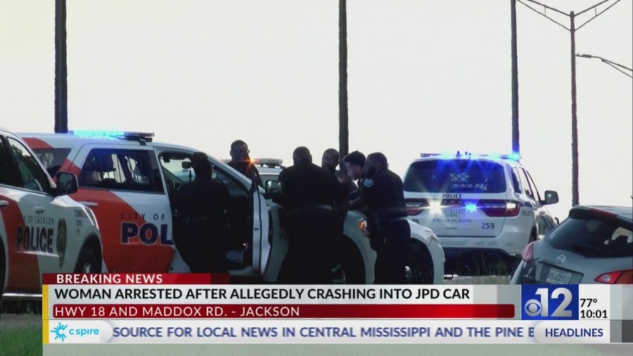 Woman arrested after allegedly crashing into JPD car