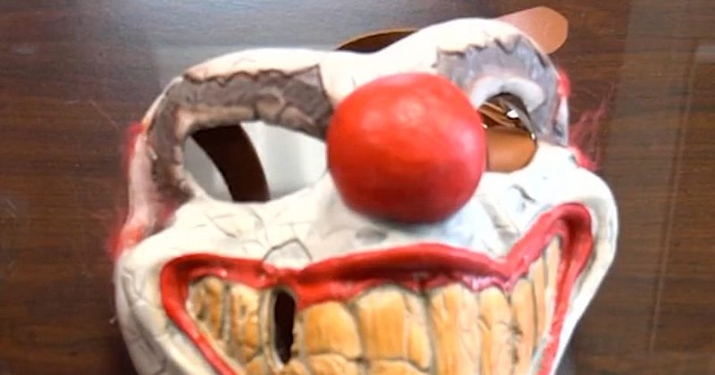 Neighbor pins down chainsaw-wielding man in clown mask, footage shows