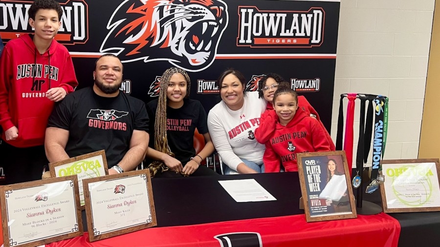 Howland record-breaker signs with college program
