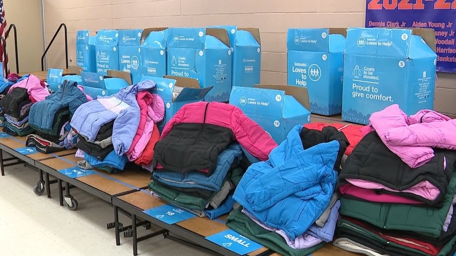 Local auto dealer gives over 300 winter coats to children in need
