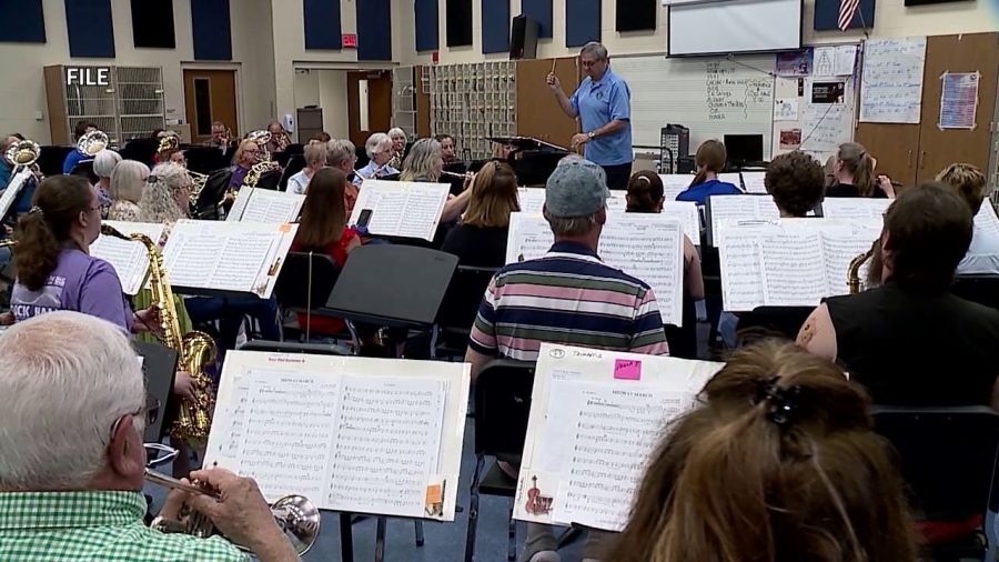 Conductor ready to pass baton for community band