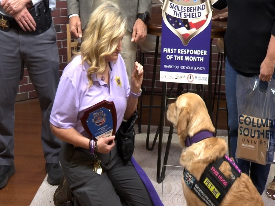 Mobile County Sheriff's Office K-9 and sergeant educate students on internet safety, receive Smiles Behind the Shield Award