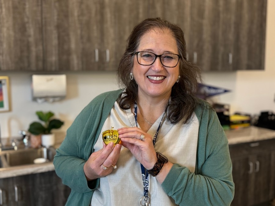 A teacher helps student start their teaching careers at Baldwin Prep