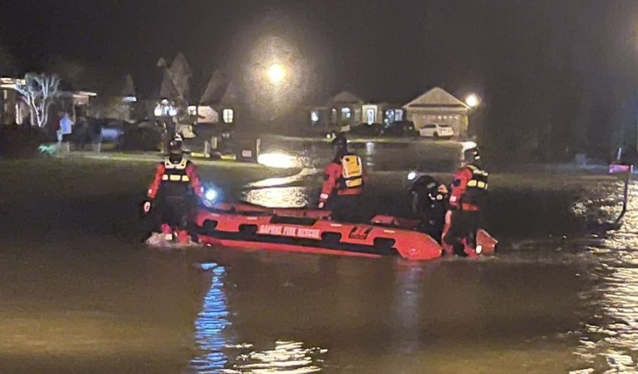 Daphne firefighters rescue families by boat during severe flooding, receive Smiles Behind the Shield Award