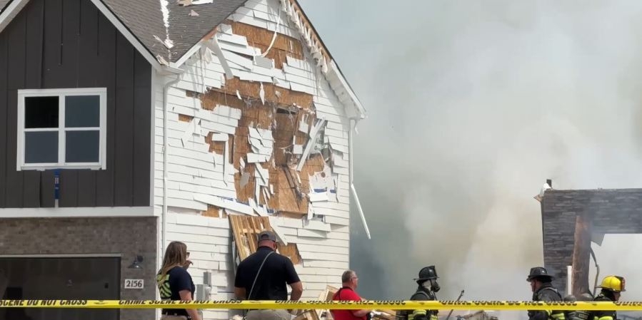 Speaking with officials about fire safety following Gallatin home explosion