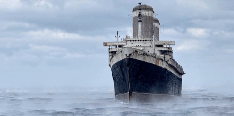 Tugboat crew successfully navigates the SS United States through rough weather