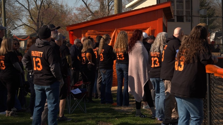 Washington softball player supported by friends and family