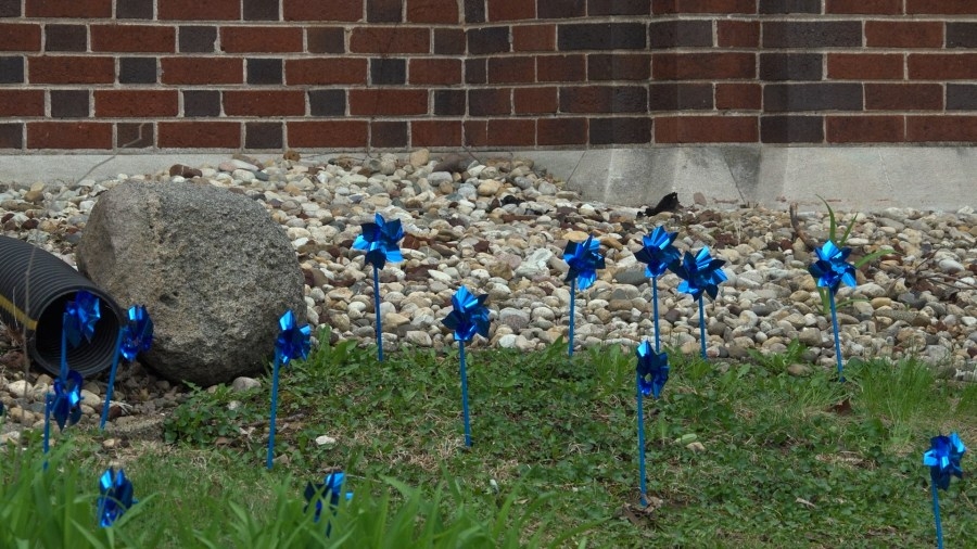 Children's Home plants pinwheels for Child Abuse Prevention Month