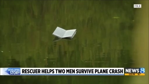 Rescuer helps two men survive plane crash