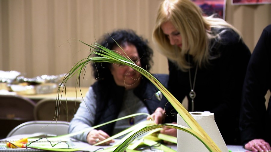 Church volunteers show off their weaving skills ahead of Palm Sunday
