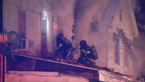 Coroner on scene of house fire in Kittanning