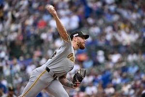 Pirates' offense stifled; Mike Burrows good but Cubs' pitching better