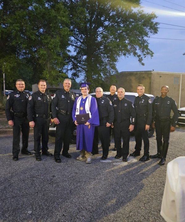 Fallen officer's son graduates, police stand by his side