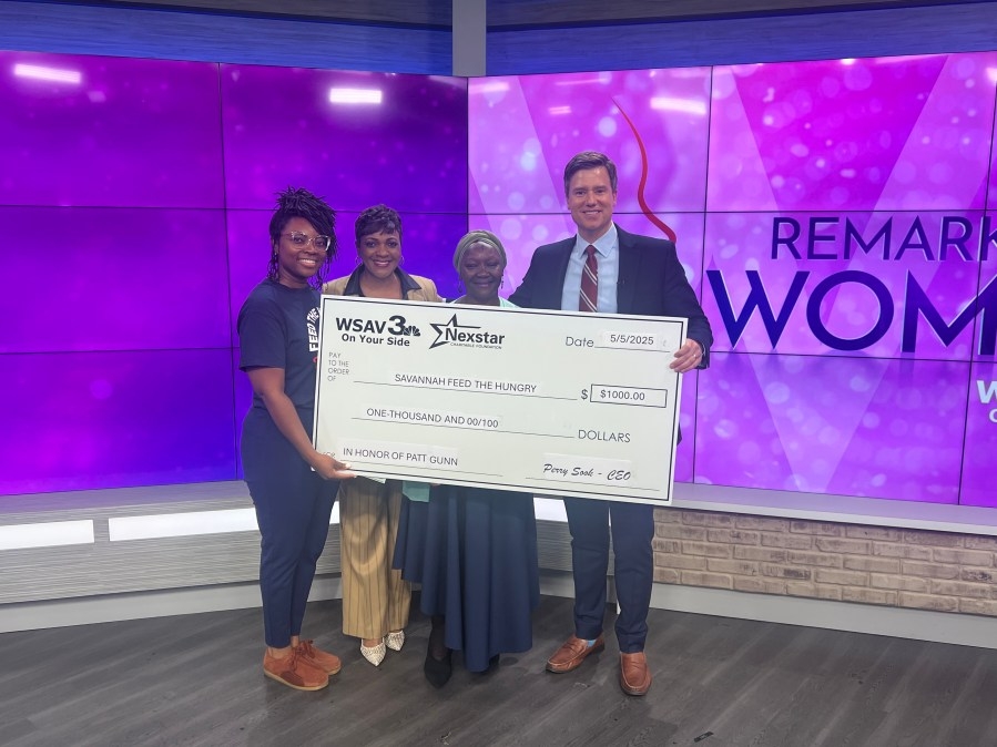 Remarkable Women check presentation to Feed The Hungry